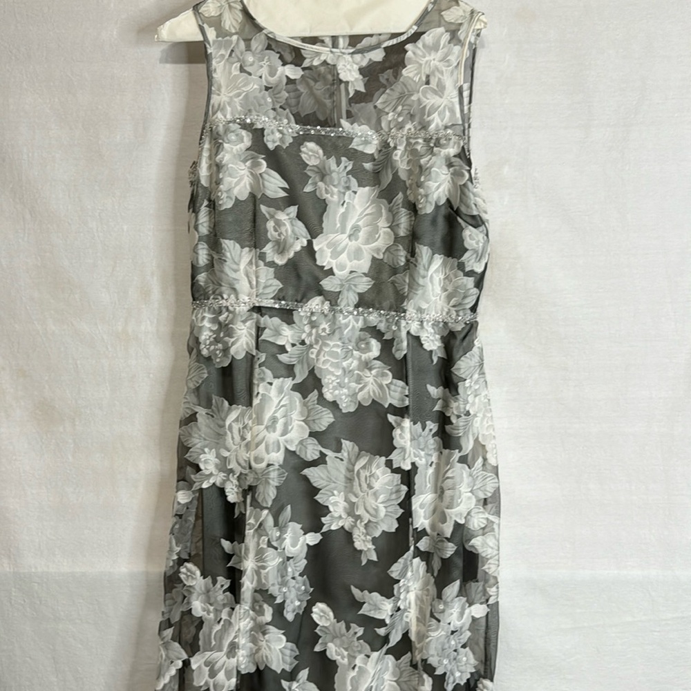 This is a beautiful evening dress. Bodice rim embellished with rhinestones.